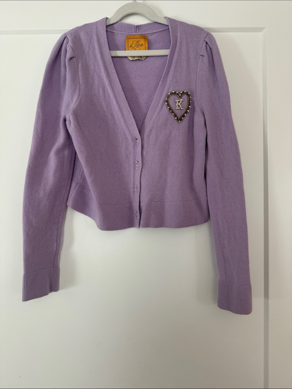 LE LION bespoke Lavender monogrammed “K” V‑Neck Cardigan Sweater with Heart pin